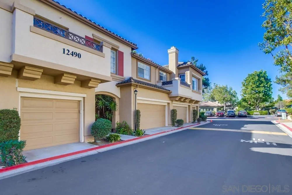 12490 Heatherton Court, Unit 10 San Diego, CA 92128 - Photo 33 of 39 a front view of a house with a yard and garage