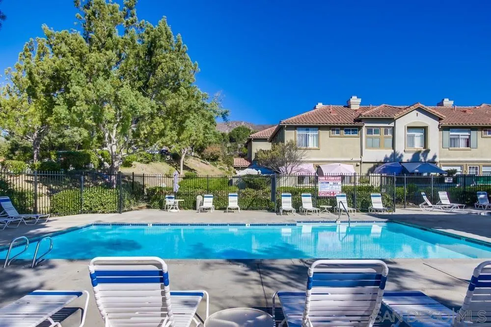 12490 Heatherton Court, Unit 10 San Diego, CA 92128 - Photo 34 of 39 a view of a house with a yard