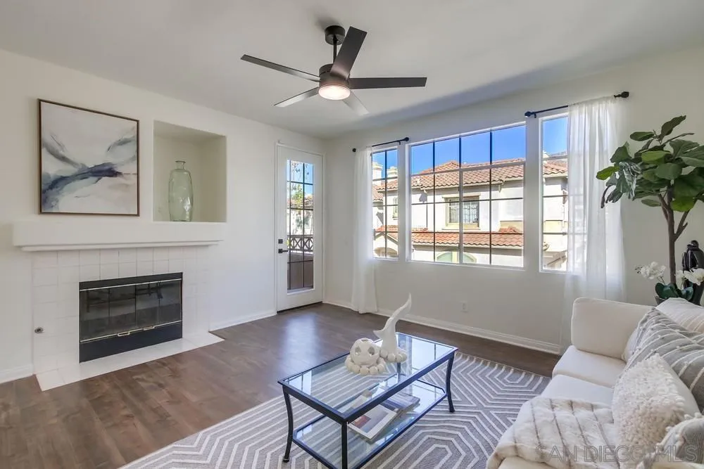 12490 Heatherton Court, Unit 10 San Diego, CA 92128 - Photo 6 of 39 a living room with furniture a window and a fireplace