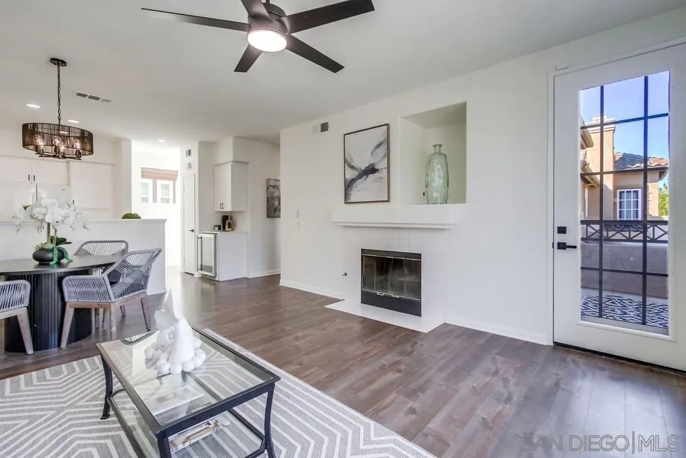 12490 Heatherton Court, Unit 10 San Diego, CA 92128 - Photo 8 of 39 a living room with furniture and a fireplace