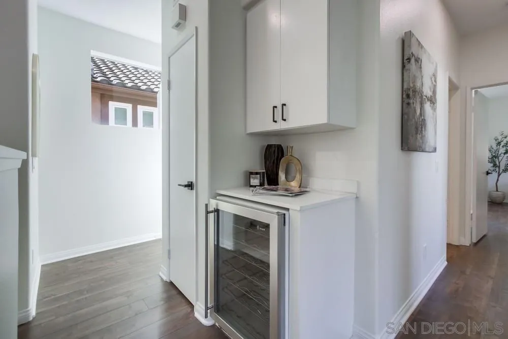 12490 Heatherton Court, Unit 10 San Diego, CA 92128 - Photo 9 of 39 a kitchen with a stove and a refrigerator
