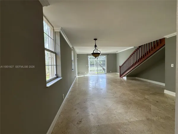 a view of entryway and hall with a window