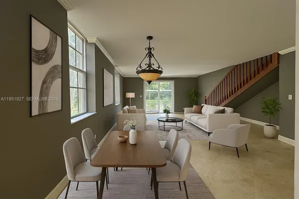 a view of a livingroom with furniture window and wooden floor