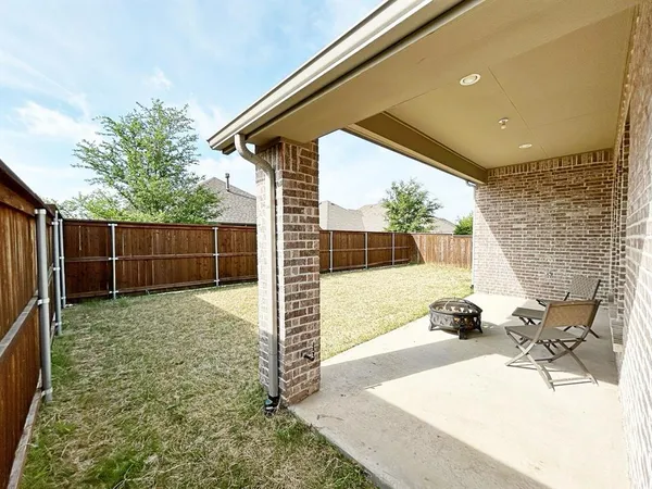 a backyard of a house with seating space