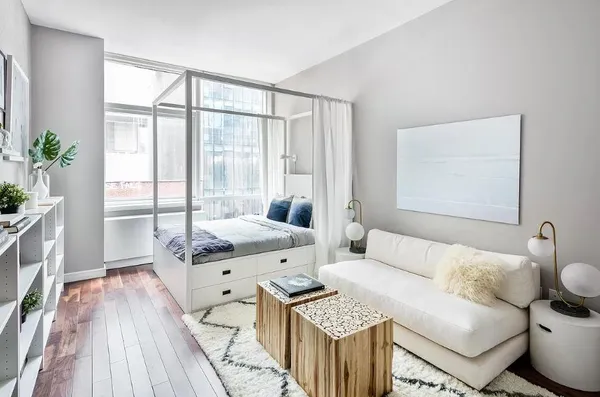 a living room with furniture and a large window