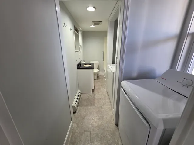 a view of a street with a tree