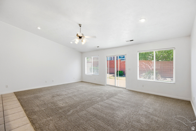 1630 East 2450th Street South, Unit 263 St. George, UT 84790 - Photo 3 of 24 Spacious room featuring vaulted ceilings, recessed lighting, and a ceiling fan