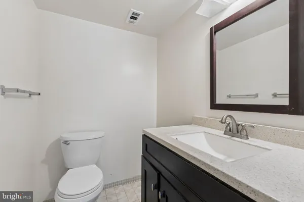 a view of an empty room with a closet