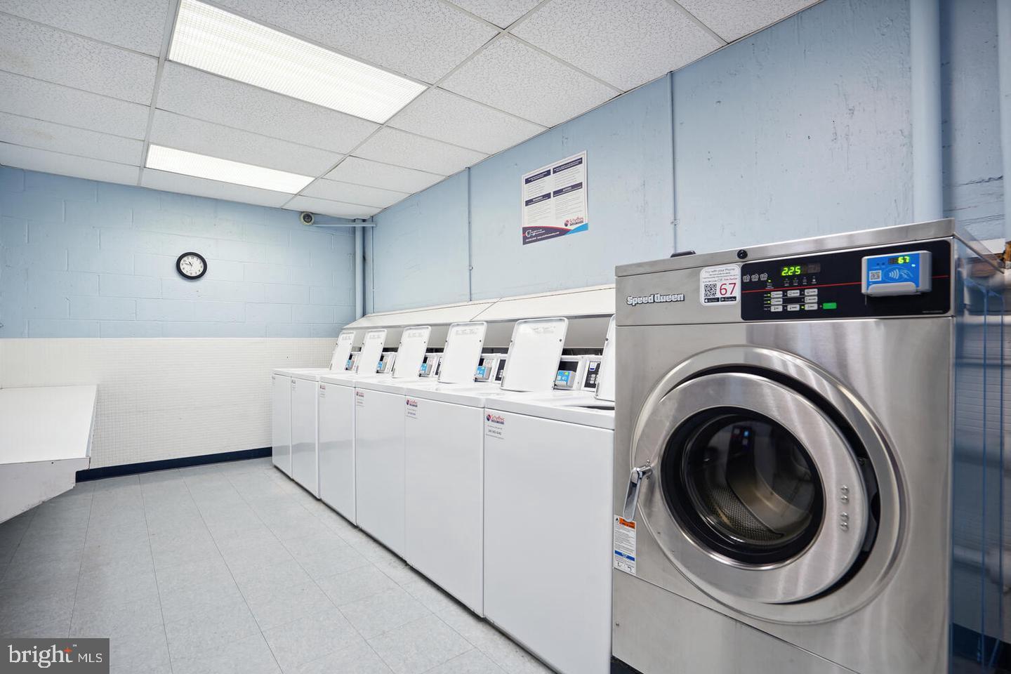 1250 4th Street Southwest, Unit W214 Washington, DC 20024 - Photo 16 of 29 Bright and modern laundry facility space.