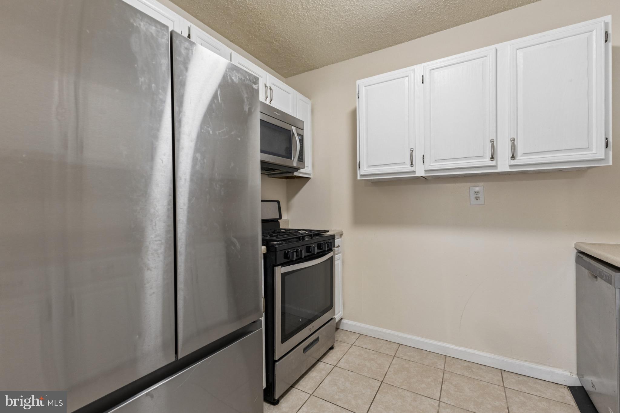 1250 4th Street Southwest, Unit W214 Washington, DC 20024 - Photo 3 of 29 Modern kitchen with sleek stainless steel appli...
