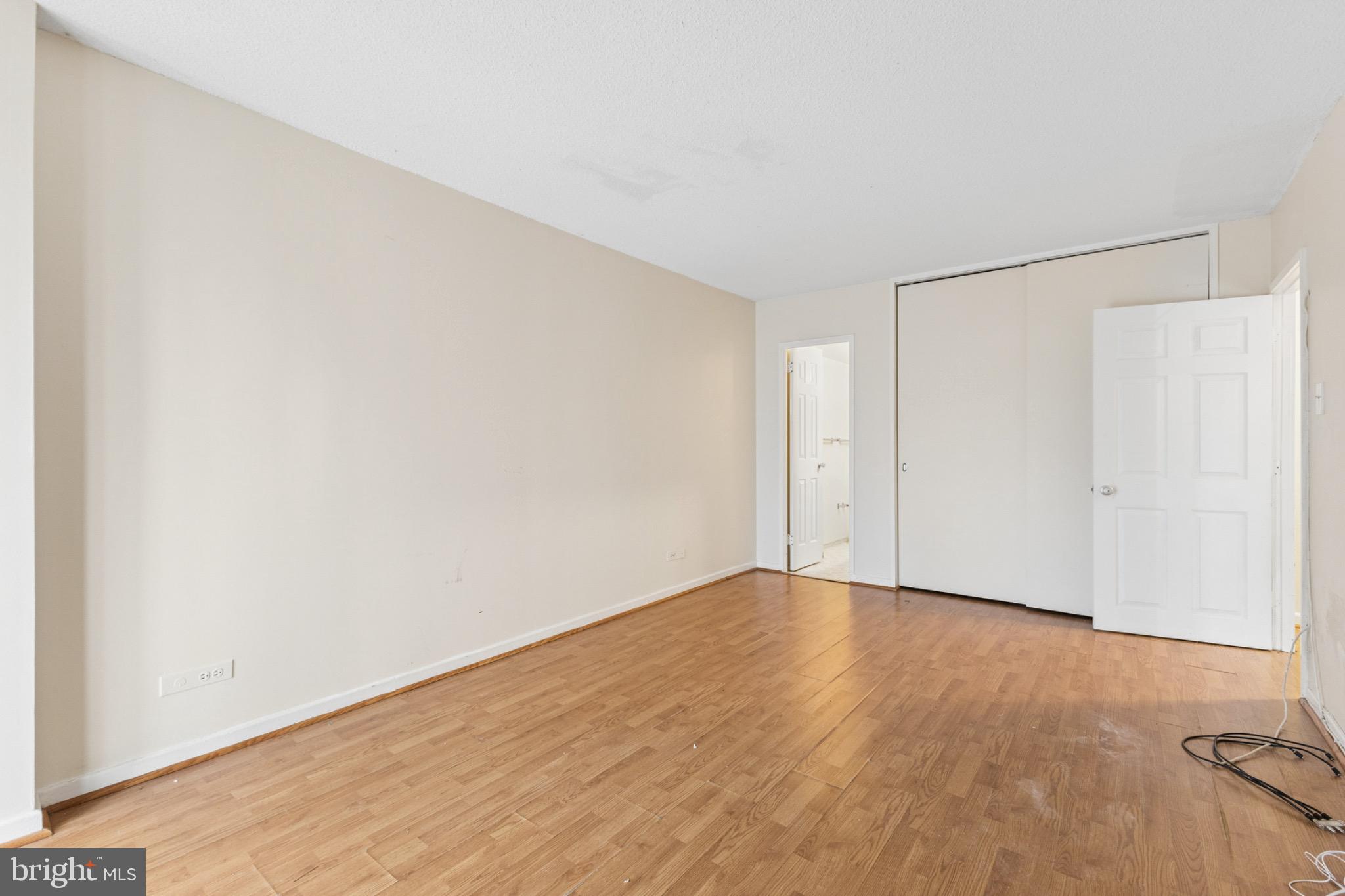 1250 4th Street Southwest, Unit W214 Washington, DC 20024 - Photo 10 of 29 Spacious room with warm wood flooring.