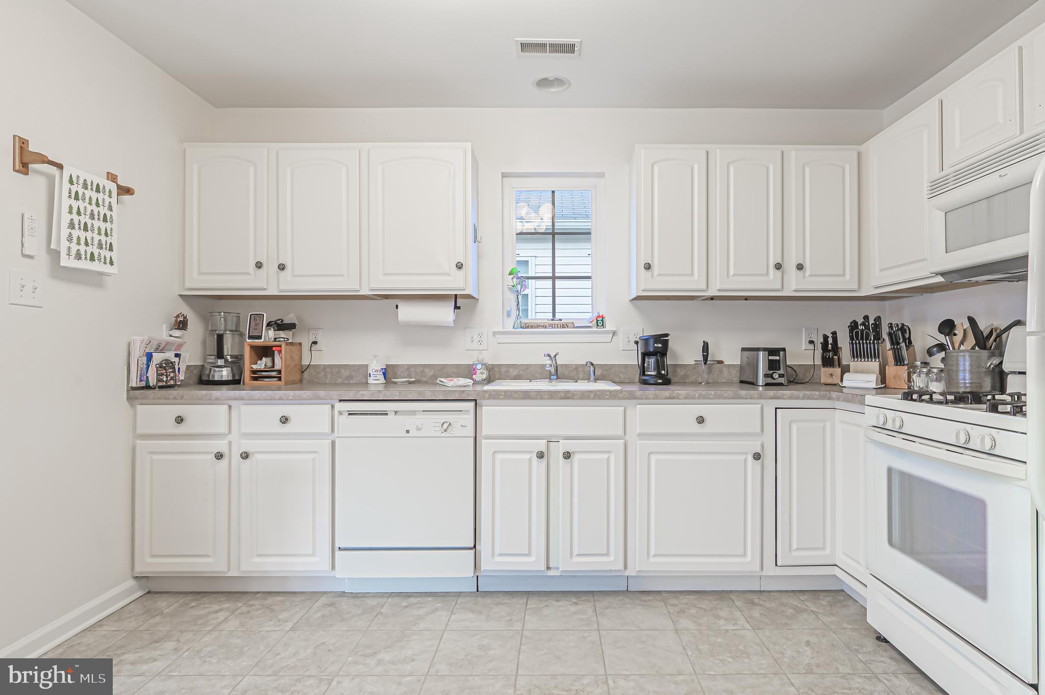 19 Gasko Road Mays Landing, NJ 08330 - Photo 21 of 32 a white kitchen with granite top and cabinets