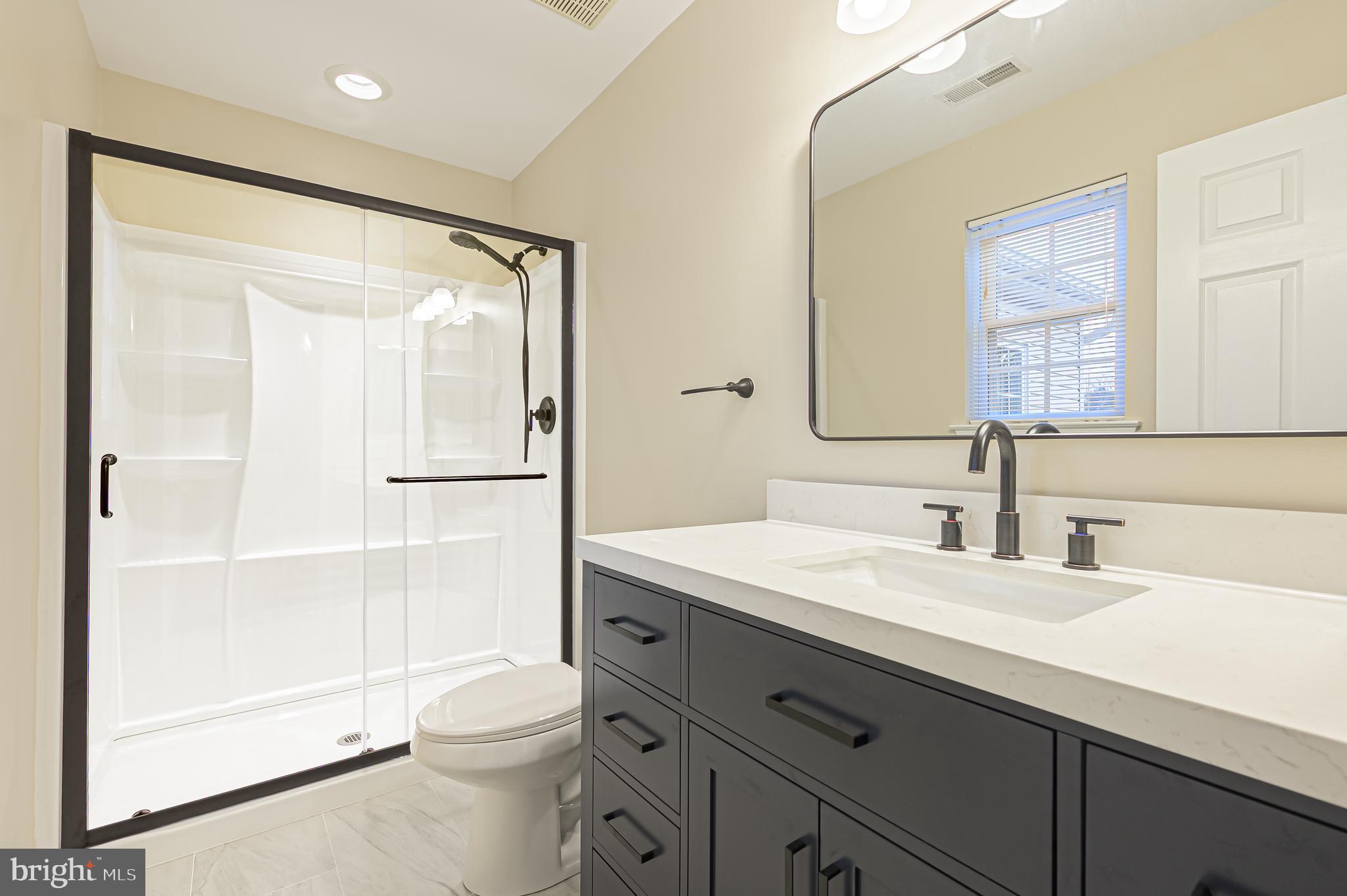19 Gasko Road Mays Landing, NJ 08330 - Photo 23 of 32 a bathroom with a sink a toilet and shower