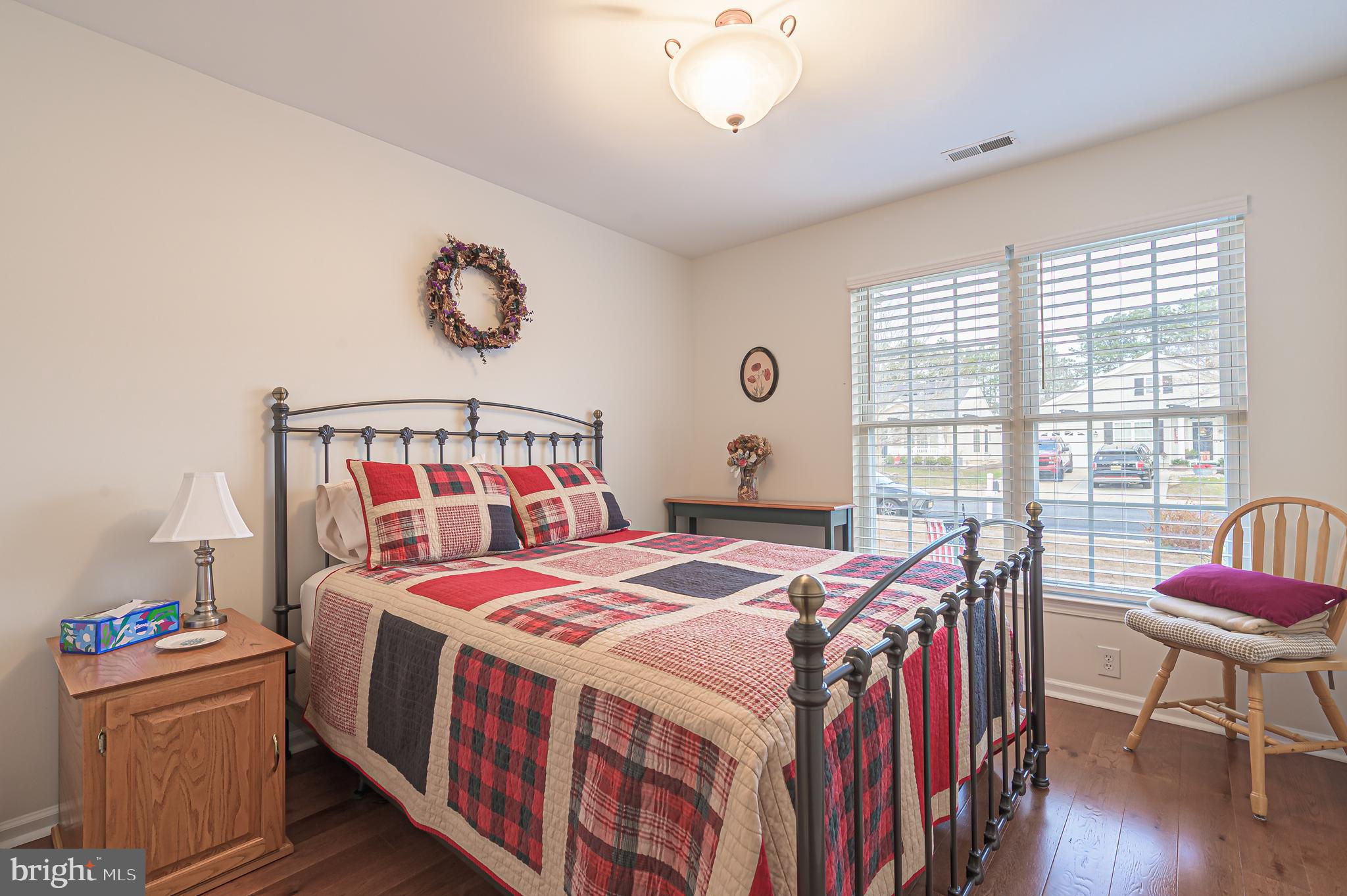 19 Gasko Road Mays Landing, NJ 08330 - Photo 24 of 32 a bedroom with a bed and a chandelier