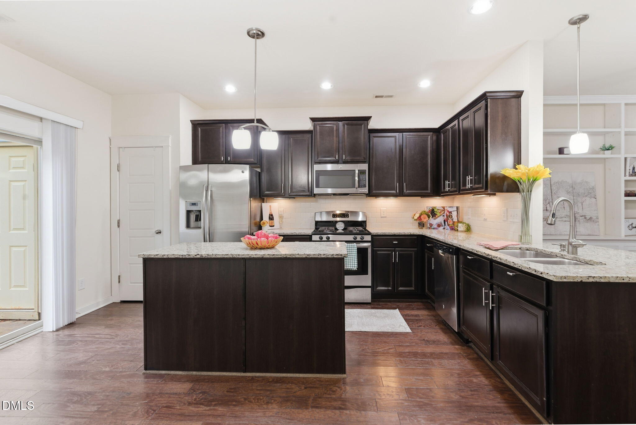 7851 Allscott Way Raleigh, NC 27612 - Photo 27 of 74 a kitchen with stainless steel appliances granite countertop a stove a sink dishwasher a refrigerator and a oven with wooden floor