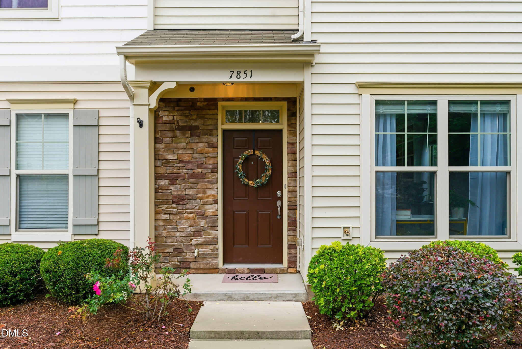 7851 Allscott Way Raleigh, NC 27612 - Photo 3 of 74 a front view of a house with potted plants