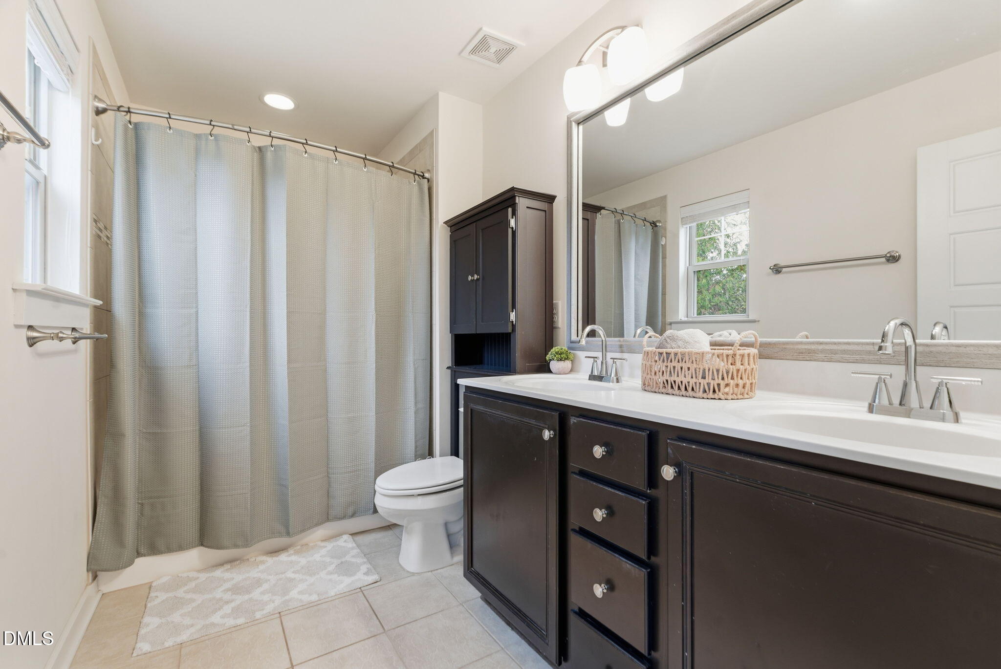7851 Allscott Way Raleigh, NC 27612 - Photo 47 of 74 a bathroom with a double vanity sink toilet and shower