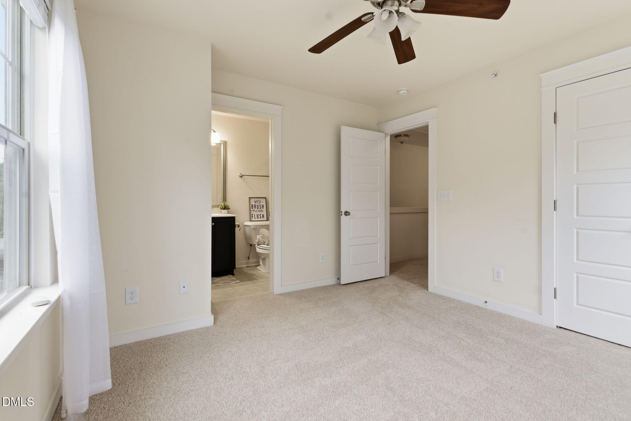 7851 Allscott Way Raleigh, NC 27612 - Photo 51 of 74 an empty room with ceiling fan and window