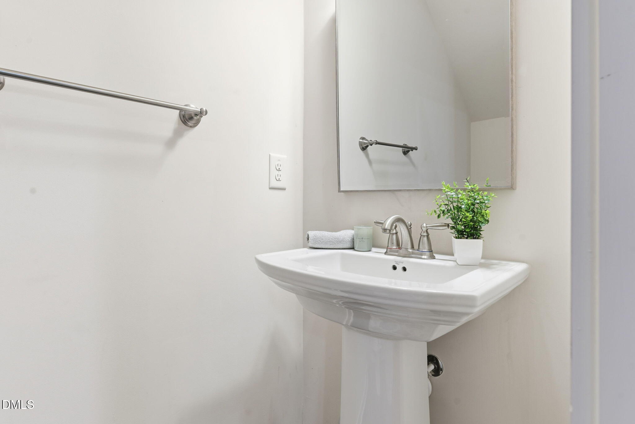 7851 Allscott Way Raleigh, NC 27612 - Photo 56 of 74 a bathroom with a sink and a mirror