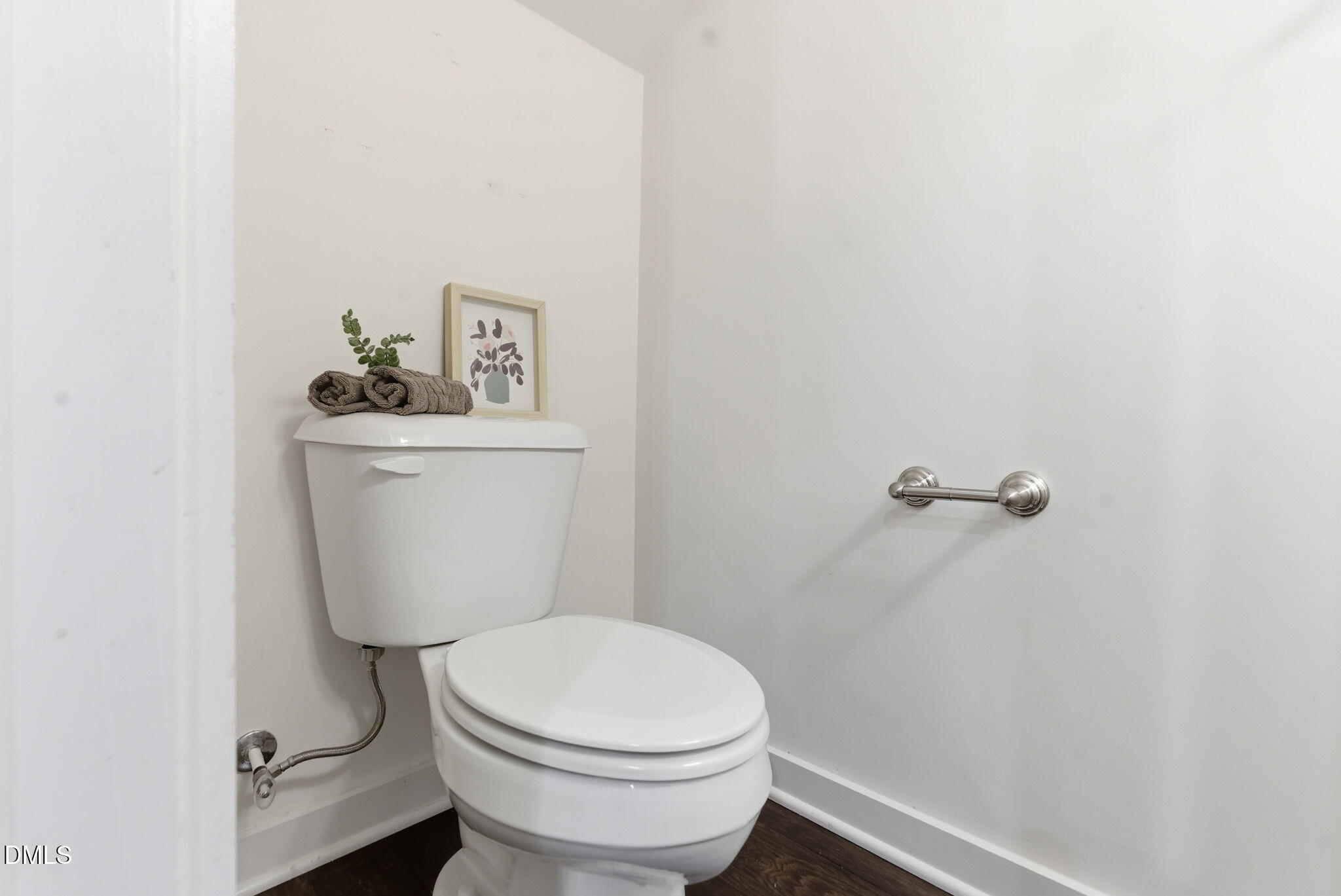 7851 Allscott Way Raleigh, NC 27612 - Photo 57 of 74 a white toilet sitting next to a small sink