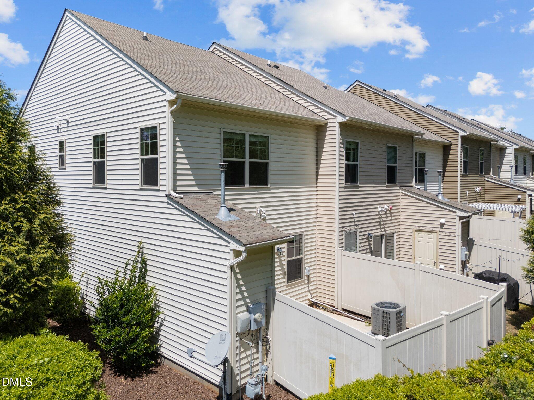7851 Allscott Way Raleigh, NC 27612 - Photo 72 of 74 a view of a house with a white roof