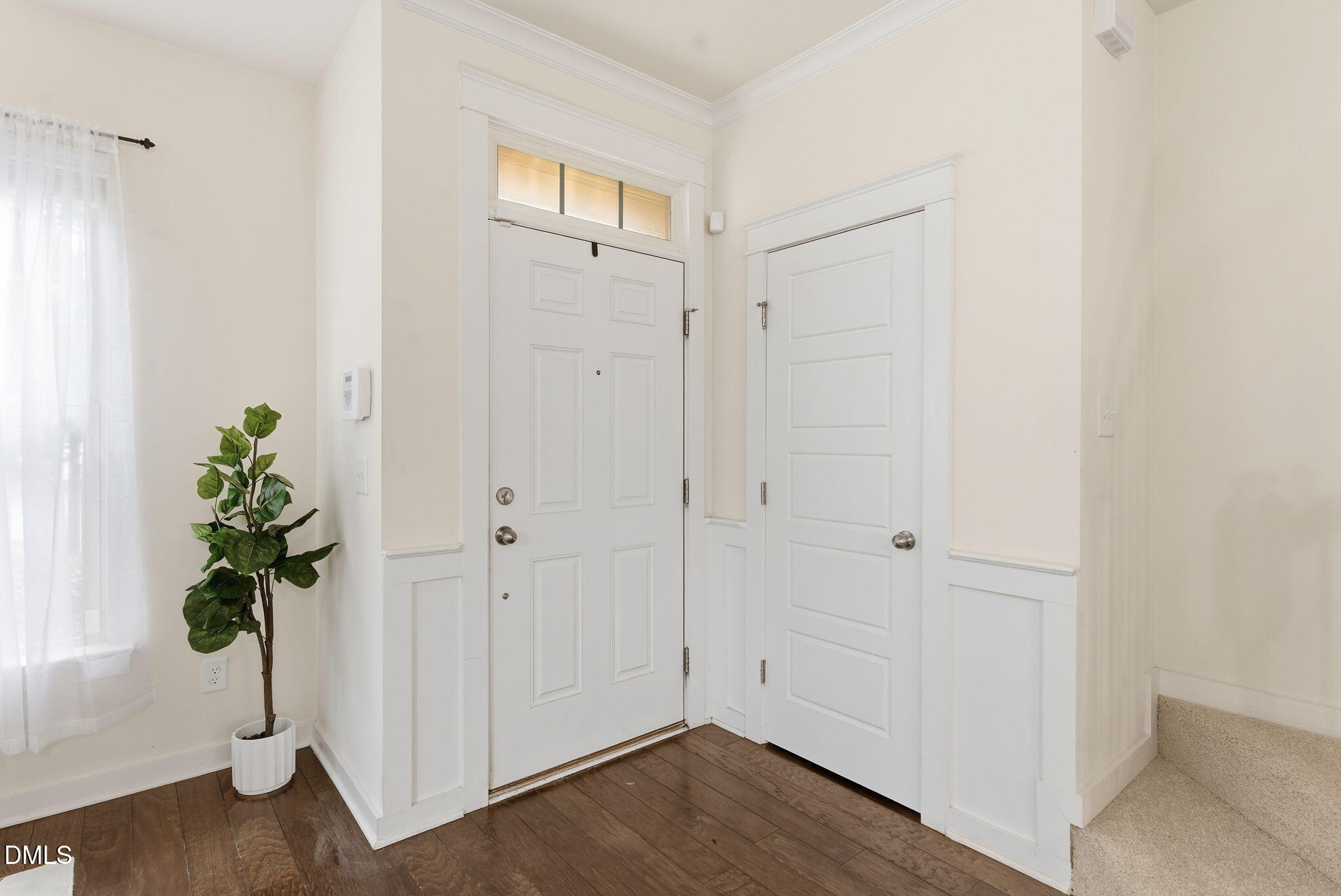 7851 Allscott Way Raleigh, NC 27612 - Photo 8 of 74 a view of an entryway with wooden floor
