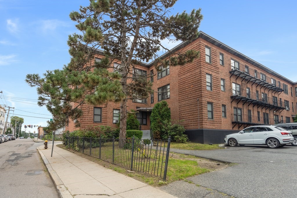 11 Victory Road, Unit 27 Boston, MA 02122 - Photo 15 of 16 a view of a car park in front of a building