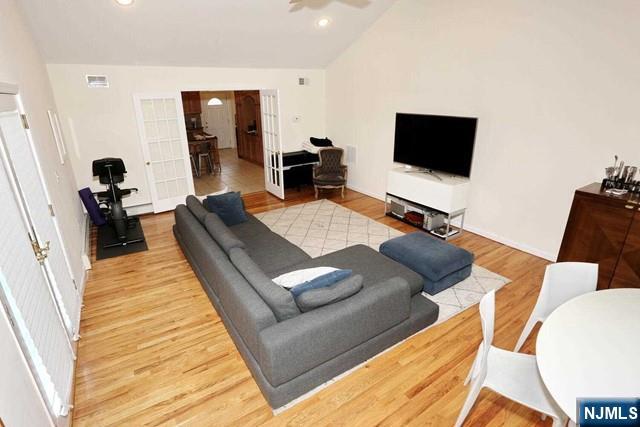 84 12th Street Cresskill, NJ 07626 - Photo 15 of 45 a living room with furniture and a flat screen tv