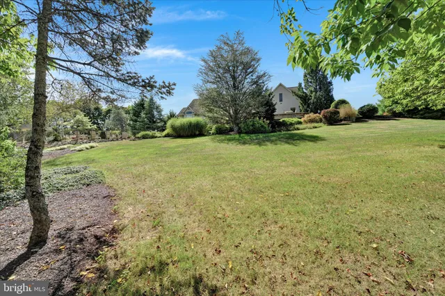 a view of an entryway with wooden floor and windows
