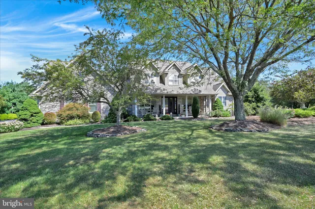front view of a brick house with a large window
