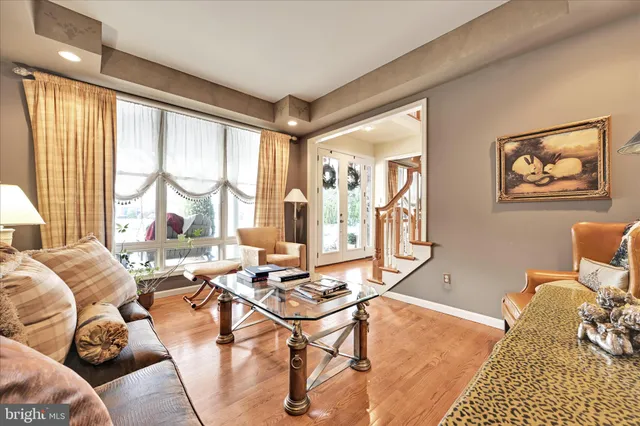 a living room with furniture fireplace and window