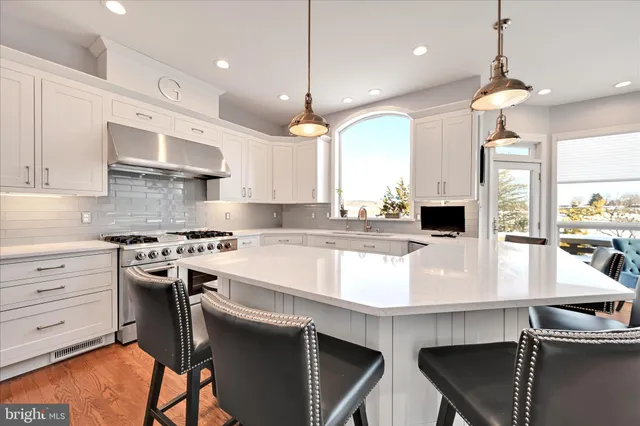 a view of an empty room with a window and cabinet