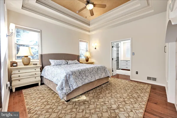 a bedroom with a bed and a mirror