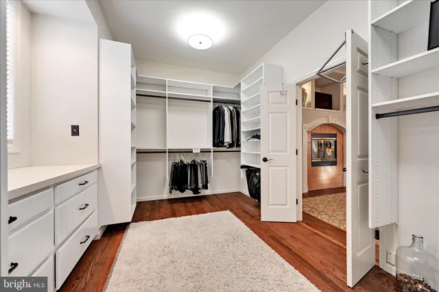 a view of a livingroom with furniture and hardwood floor