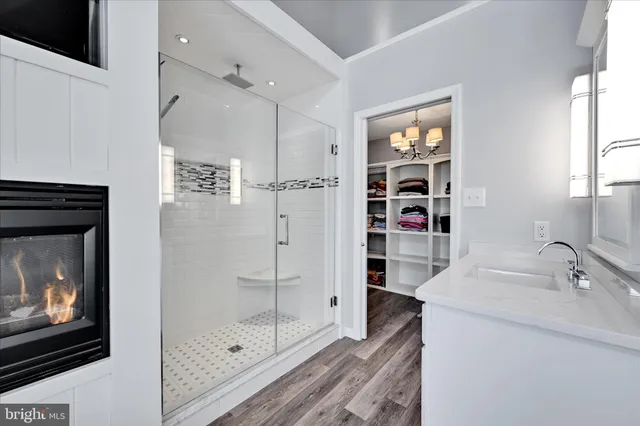 a room with lots of furniture and a wooden floor