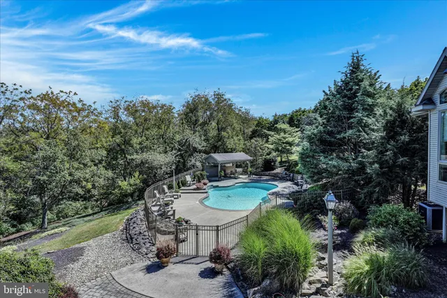a view of a swimming pool with a patio