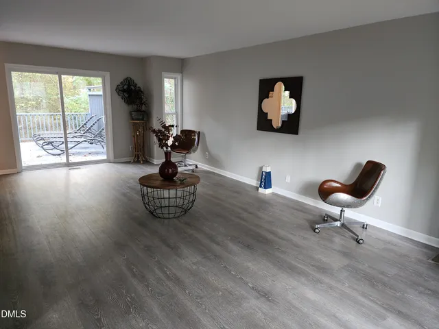 a view of a livingroom with furniture and furniture