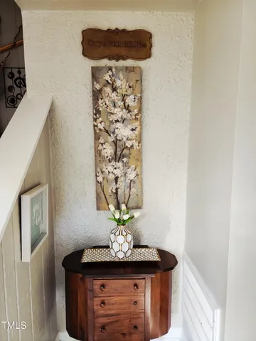 a view of workspace filled with furniture and wooden floor