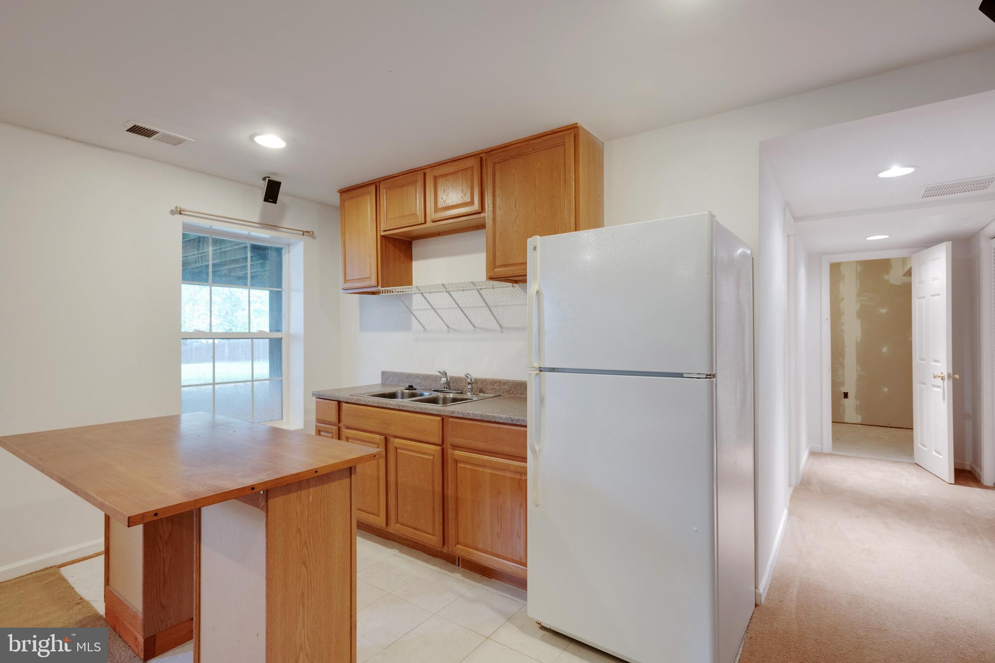 864 Fox Den Road Culpeper, VA 22701 - Photo 49 of 66 Wet bar and refrigerator in basement