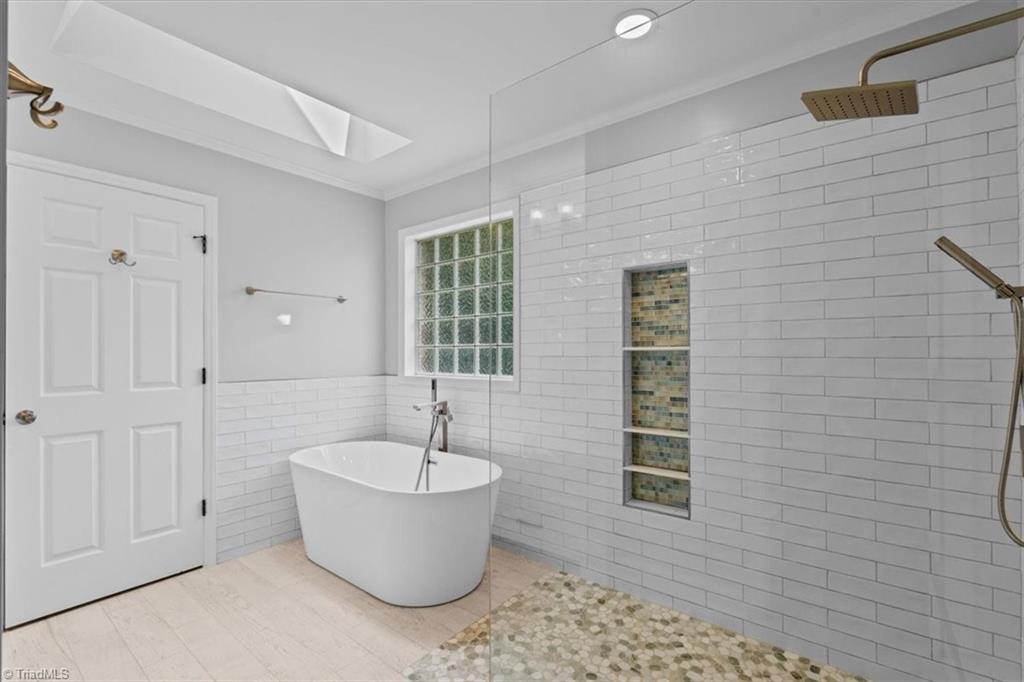 592 Carson Ridge Drive Oak Ridge, NC 27310 - Photo 19 of 39 Tiled shower and soaking tub