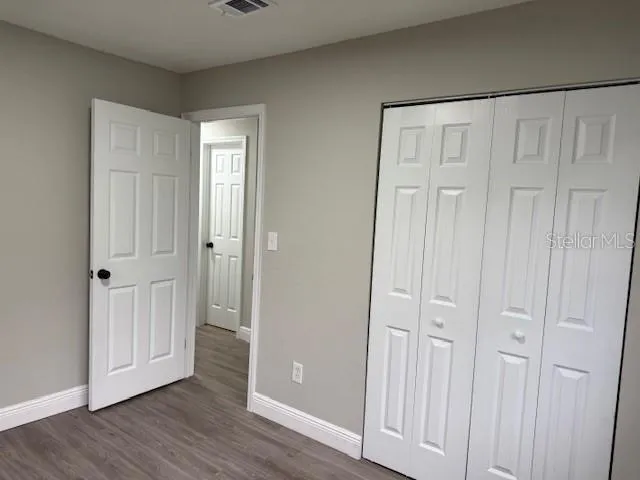 wooden floor with white walls