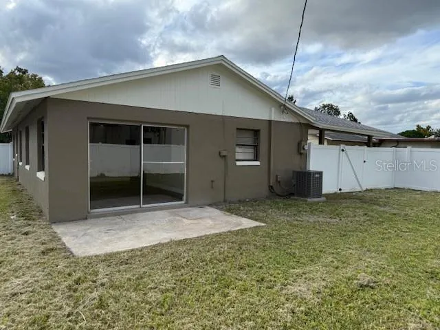 a house view with a backyard space