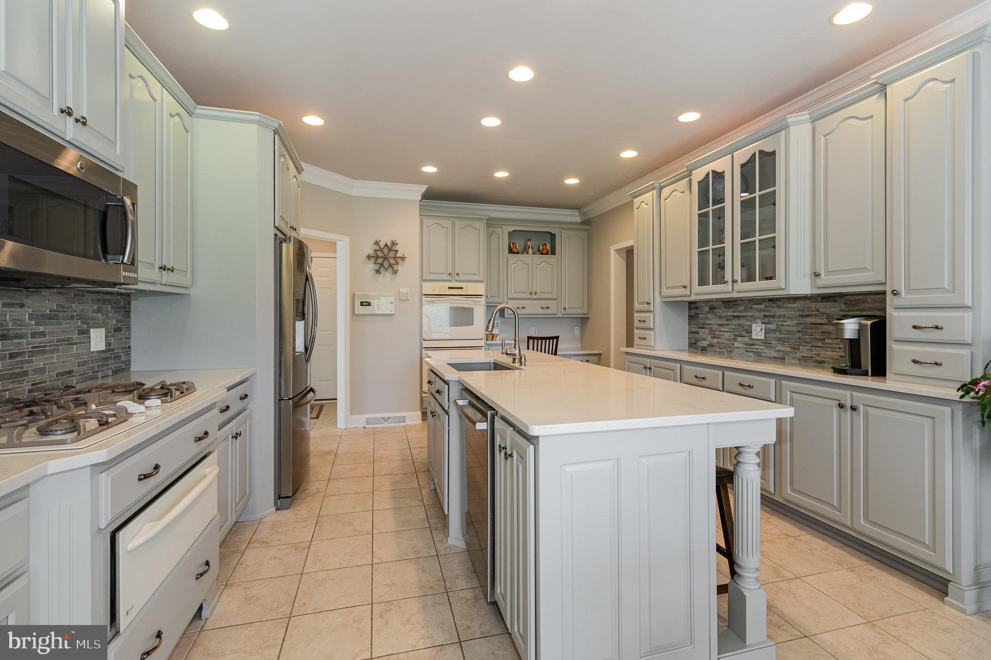140 Madara Drive Hanover, PA 17331 - Photo 13 of 57 a kitchen with a sink stove and refrigerator