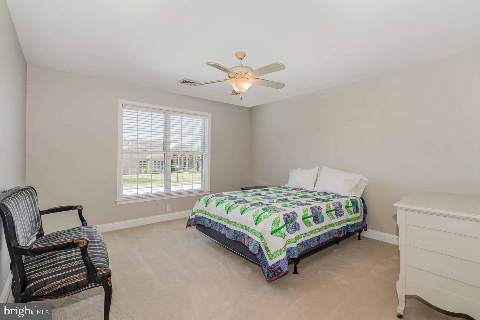 140 Madara Drive Hanover, PA 17331 - Photo 24 of 57 a bedroom with a bed and a chandelier