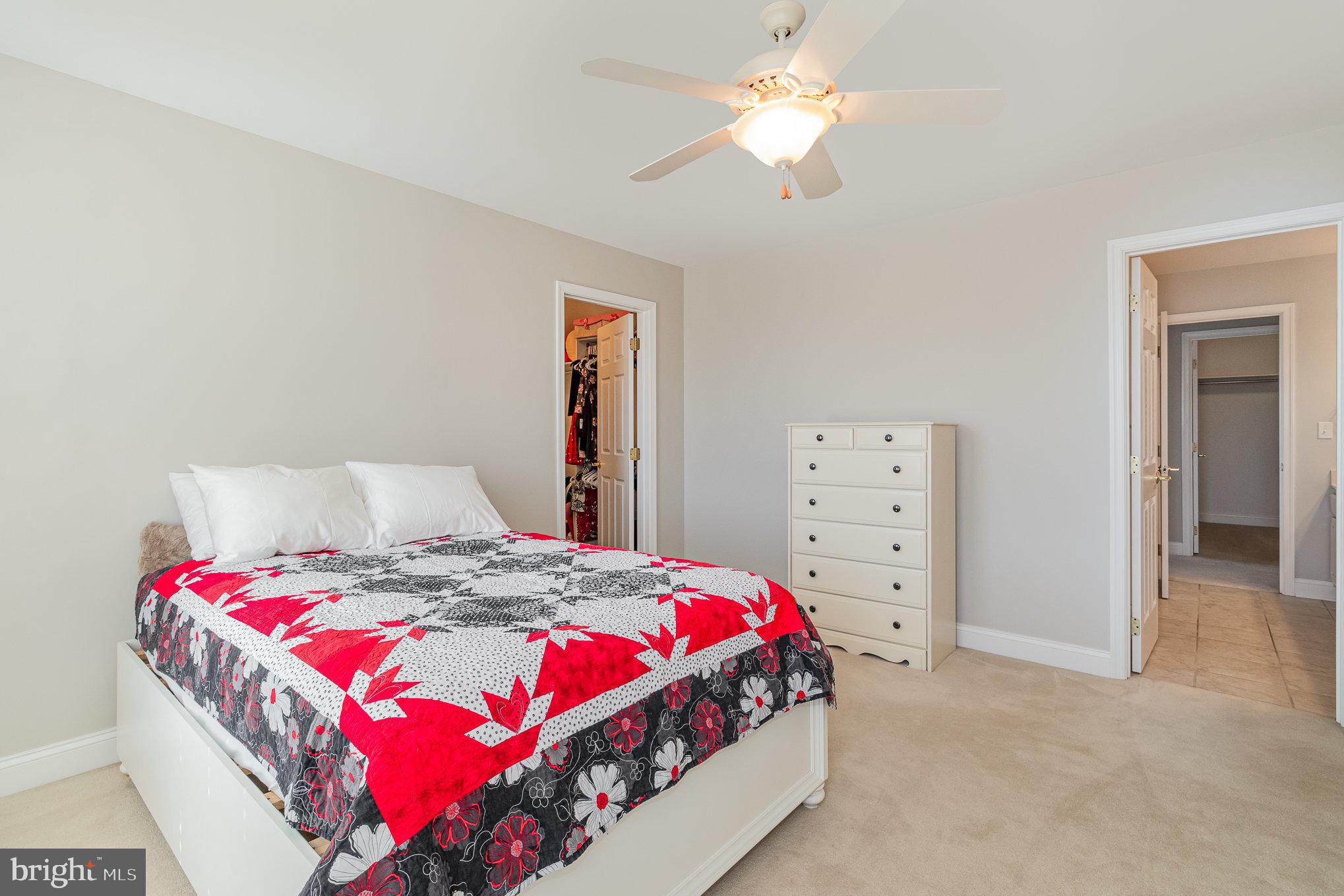 140 Madara Drive Hanover, PA 17331 - Photo 30 of 57 a bedroom with a bed and a chandelier