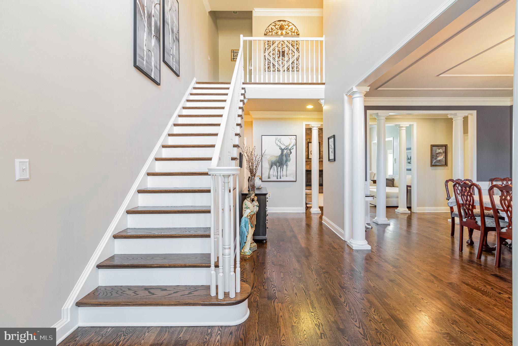 140 Madara Drive Hanover, PA 17331 - Photo 4 of 57 a view of a hallway with wooden floor and stairs