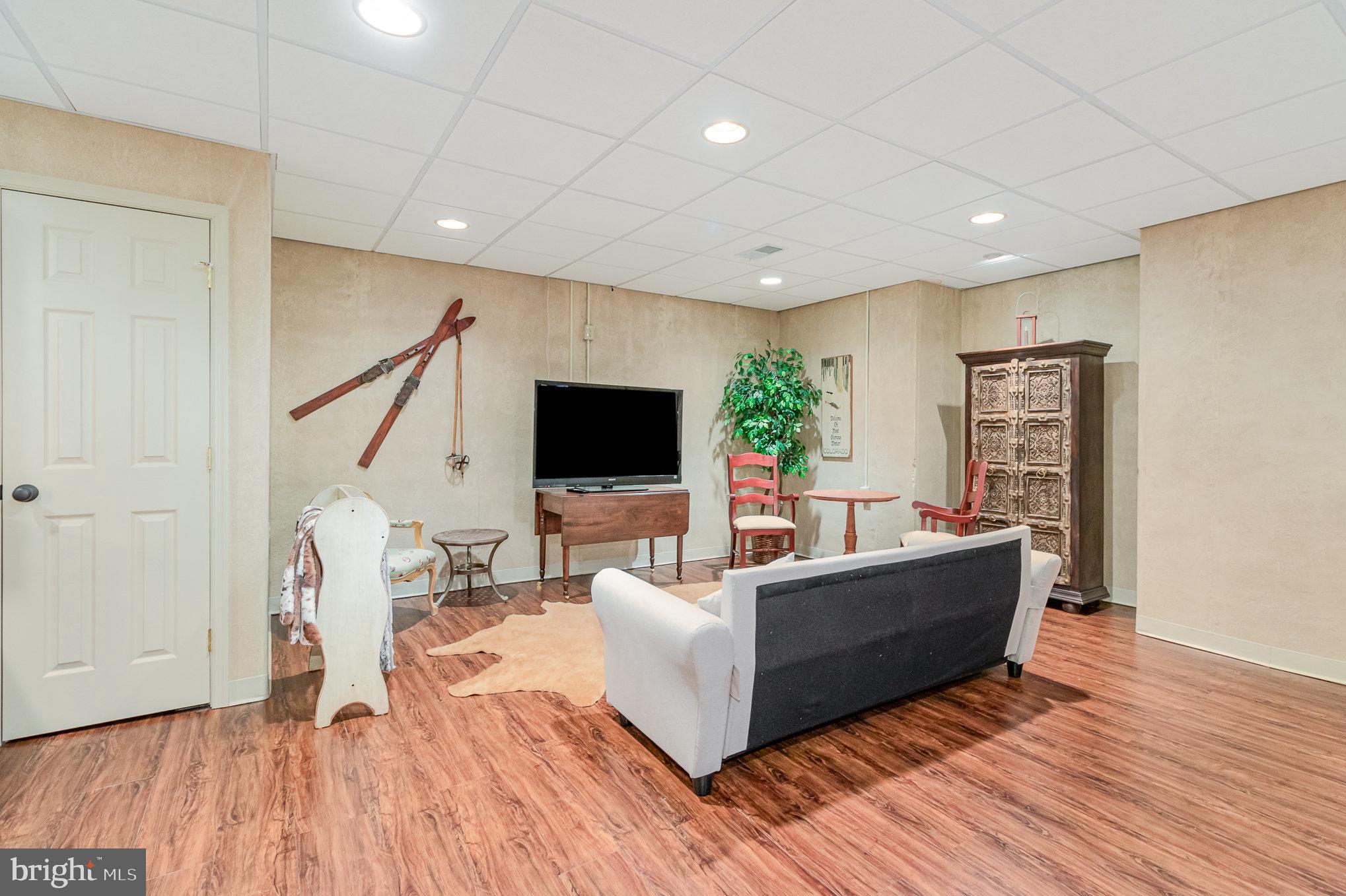 140 Madara Drive Hanover, PA 17331 - Photo 42 of 57 a living room with furniture and a flat screen tv