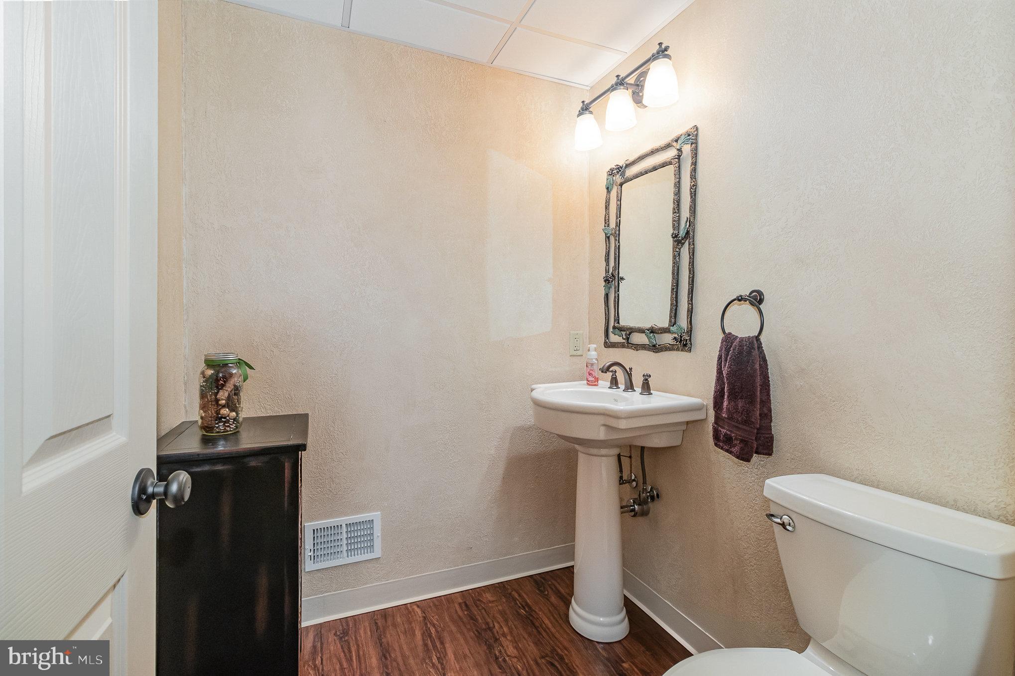140 Madara Drive Hanover, PA 17331 - Photo 44 of 57 a bathroom with a sink a toilet and mirror