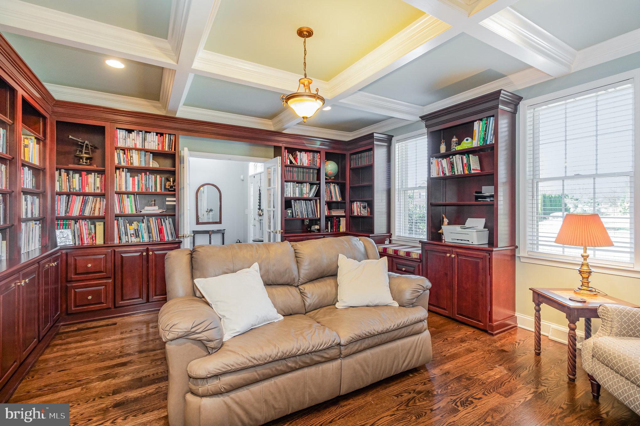 140 Madara Drive Hanover, PA 17331 - Photo 8 of 57 a living room with furniture a lamp and a bookshelf