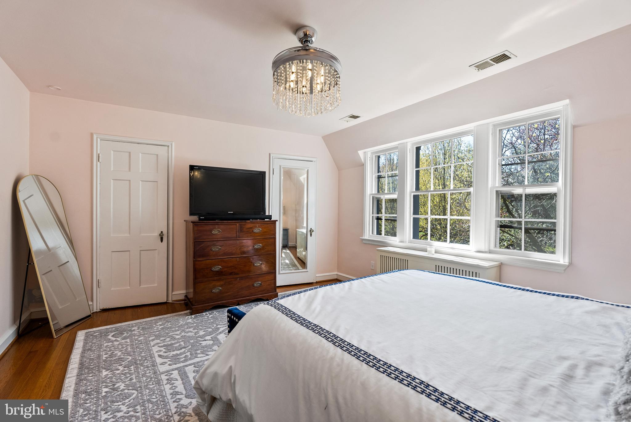 1511 44th Street Northwest Washington, DC 20007 - Photo 19 of 37 a bedroom with a bed and a flat screen tv